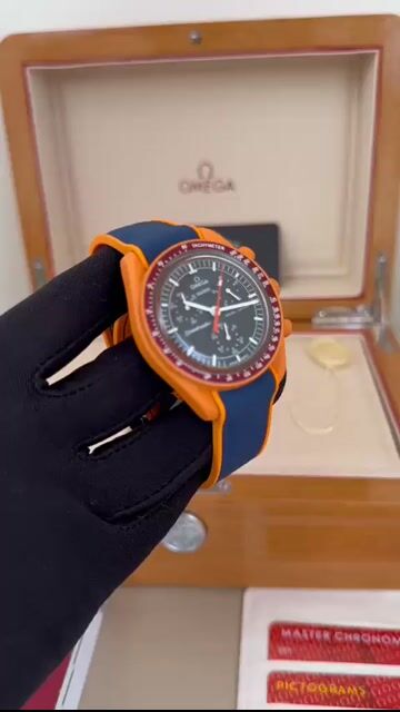 Video de Omega Swatch Speedmaster Moonswatch 40mm - MOSTRADOR PRETO - SILICONE AZUL COM LARANJA