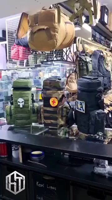 Video de PORTA TERMO MATERA DE CORDURA CON MOLLE BOLSILLOS LATERALES CORREA Y ABROJO